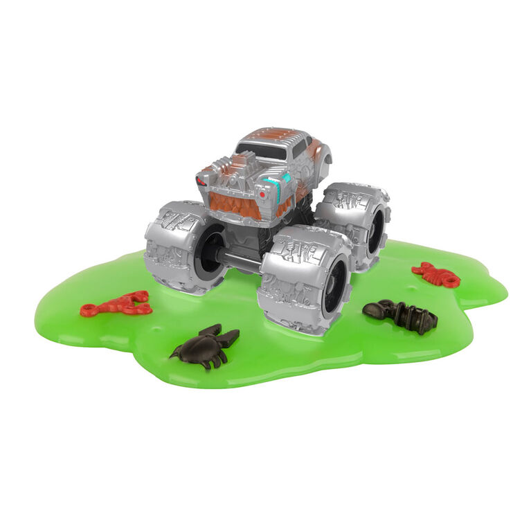 De véritables véhicules-jouets Monster Treads, sac opaque avec de la boue pour une expérience unique de déballage.