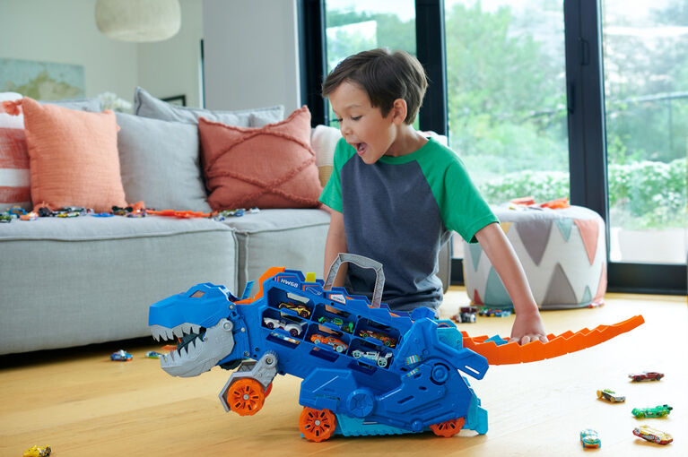 Hot Wheels City Ultimate Hauler, Transforms into a T-Rex with Race Track, Stores 20+ Cars