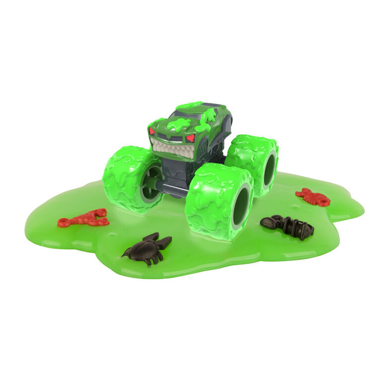 De véritables véhicules-jouets Monster Treads, sac opaque avec de la boue pour une expérience unique de déballage.