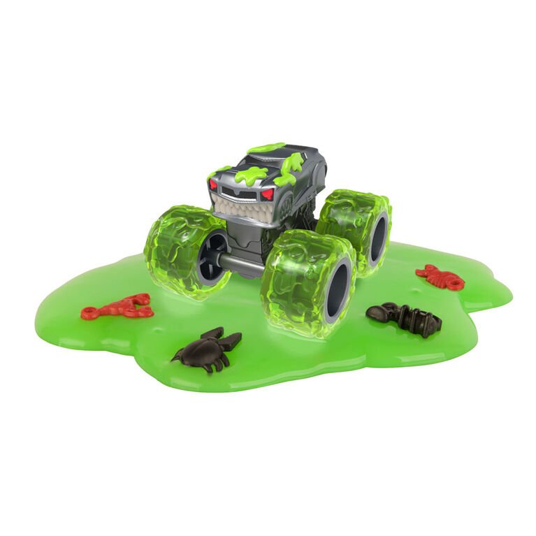 De véritables véhicules-jouets Monster Treads, sac opaque avec de la boue pour une expérience unique de déballage.